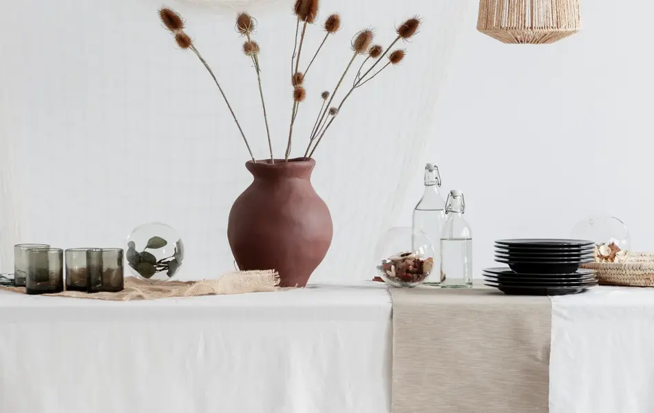 Clay vase on the table in vintage kitchen