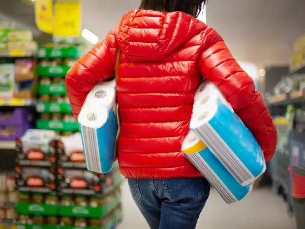 Customer hoarding paper towels during the coronavirus crisis in Germany