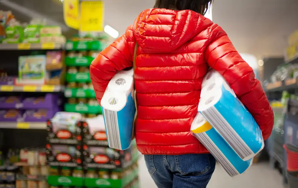 Customer hoarding paper towels during the coronavirus crisis in Germany