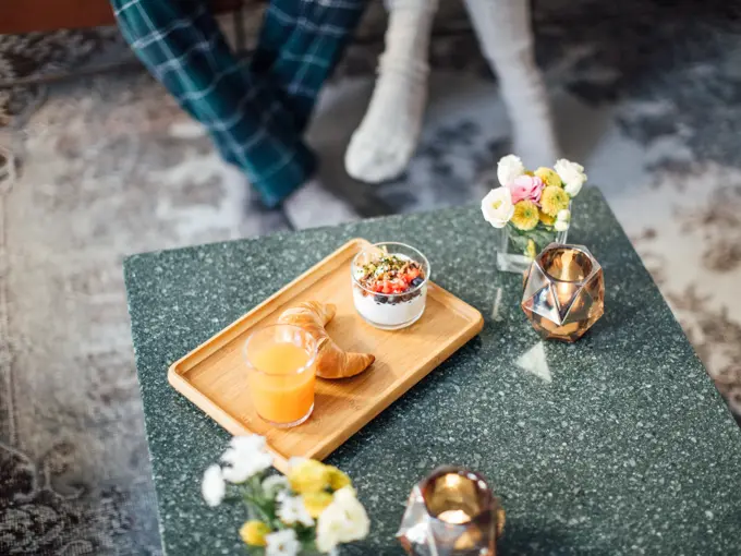 High angle view of healthy breakfast in tray on coffee table at home