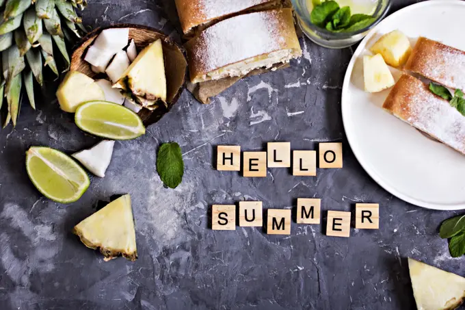 Pie, strudel, cake with cheese and exotic fruits-with pineapple, coconut, lime. The inscription "Hello summer"