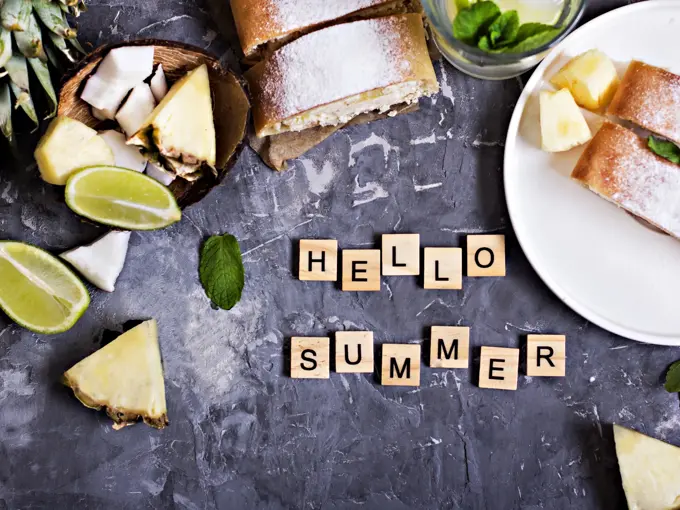 Pie, strudel, cake with cheese and exotic fruits-with pineapple, coconut, lime. The inscription "Hello summer"