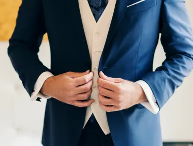 Businessman or groom getting dressed