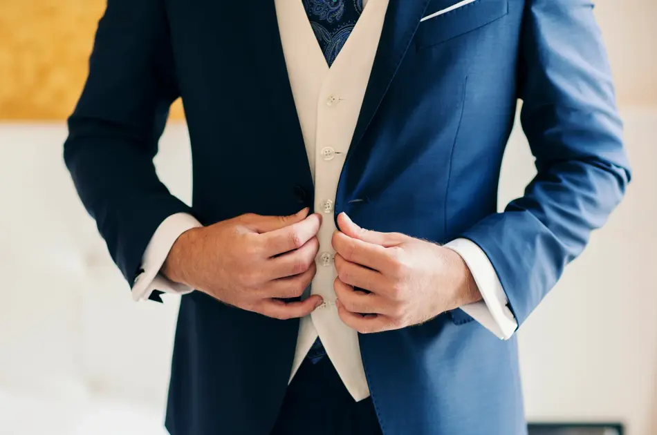 Businessman or groom getting dressed