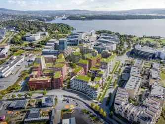 Illustrasjonsbilde av boligprosjektet Flytårnet Stasjon. Et samarbeidsprosjekt mellom OBOS og Thon Bolig.