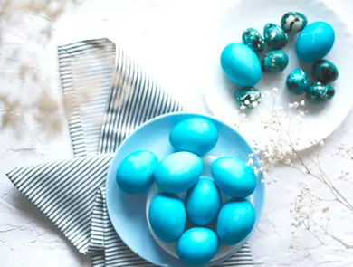 Bright easter composition with colored blue eggs. Easter flat lay.