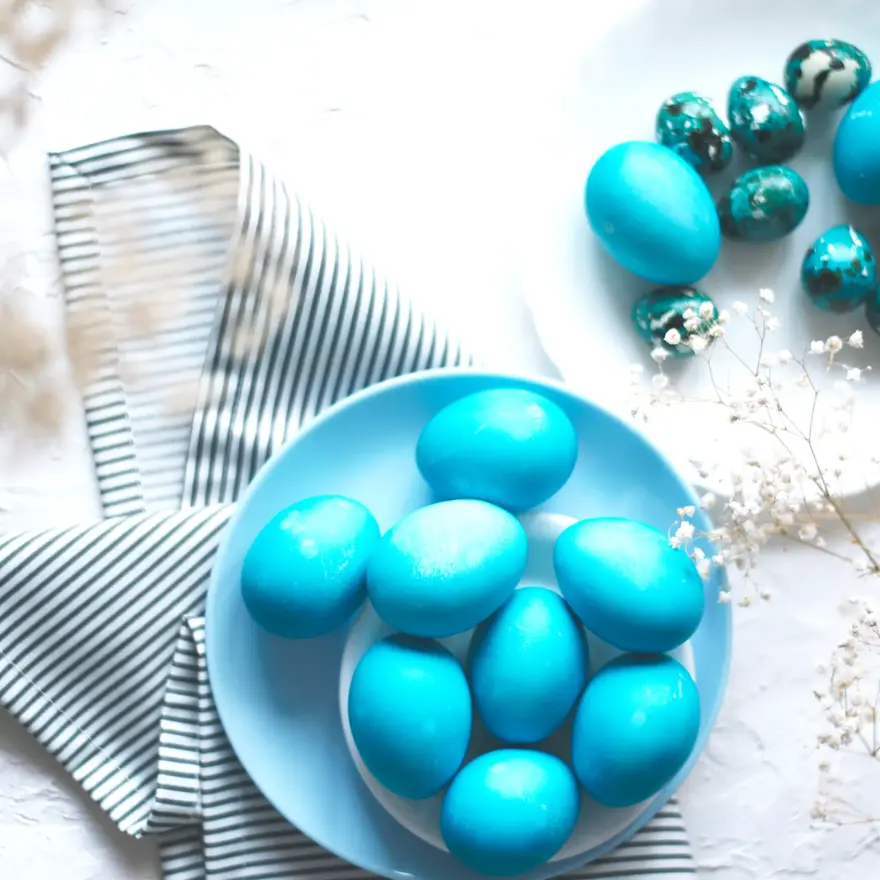 Bright easter composition with colored blue eggs. Easter flat lay.