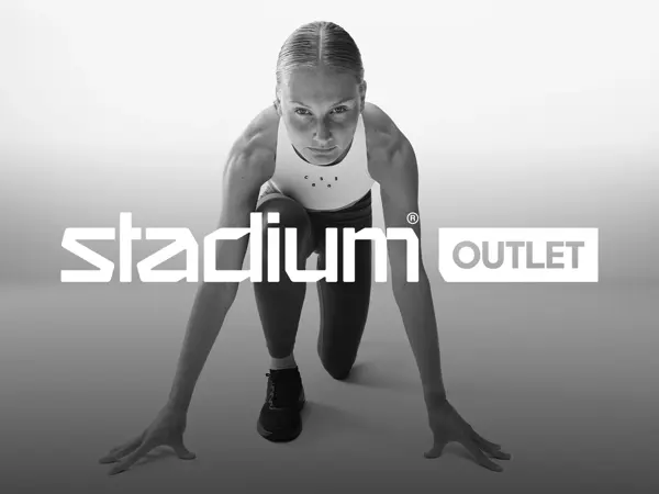 Stadium Outlet logo med kvinne i startløp-posisjon i bakgrunnen