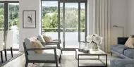 3D illustrasjon av stuen i en leilighet i boligprosjektet Parkodden i Lillestrøm.