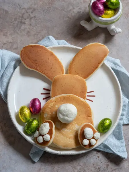 Easter funny bunny pancakes with chocolate eggs