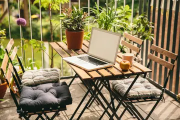 Laptop on balcony loggia in summer's bloom with bistro chairs and a view in the yard, Cologne, NRW, Germany (Laptop on balcony loggia in summer's bloom with bistro chairs and a view in the yard, Cologne, NRW, Germany, ASCII, 110 components, 110 by