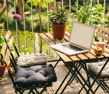 Laptop on balcony loggia in summer's bloom with bistro chairs and a view in the yard, Cologne, NRW, Germany (Laptop on balcony loggia in summer's bloom with bistro chairs and a view in the yard, Cologne, NRW, Germany, ASCII, 110 components, 110 by