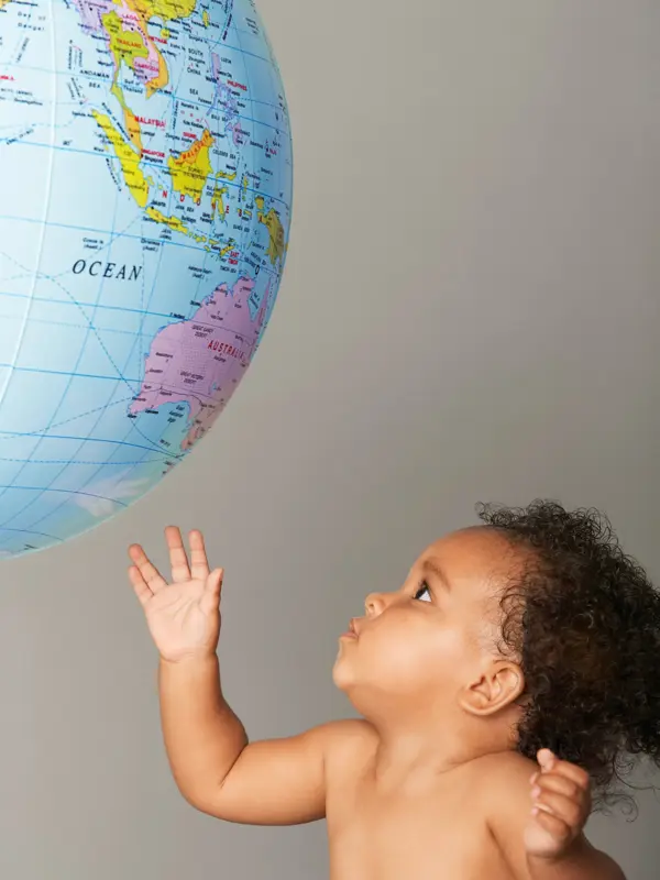 Baby Looking at Globe