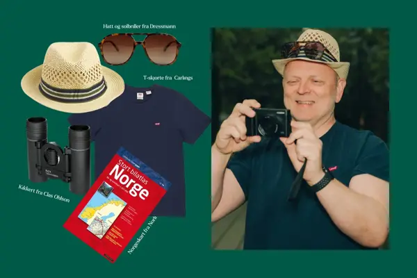 mann med kamera, hatt og solbriller