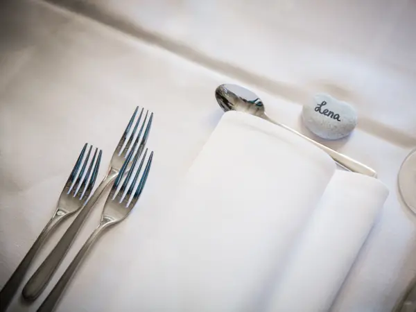 Table setting detail at a wedding reception.