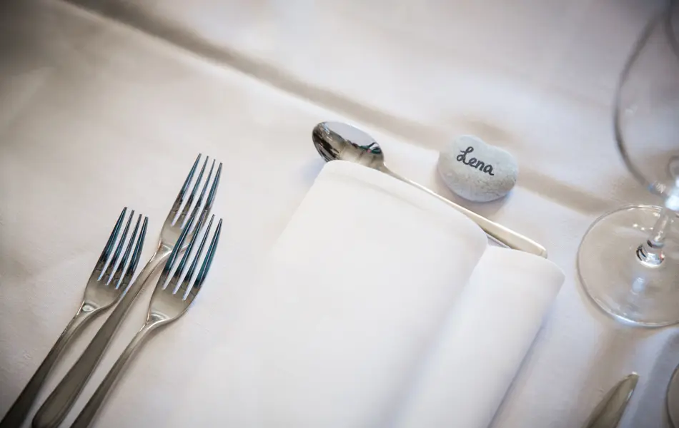 Table setting detail at a wedding reception.