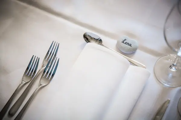 Table setting detail at a wedding reception.