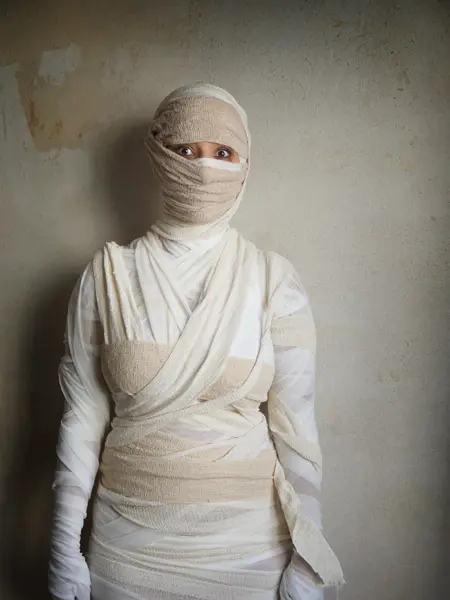 woman wrapped in bandages as egyptian mummy halloween costume