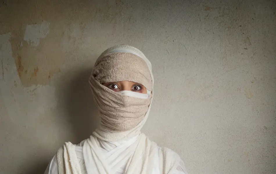 woman wrapped in bandages as egyptian mummy halloween costume