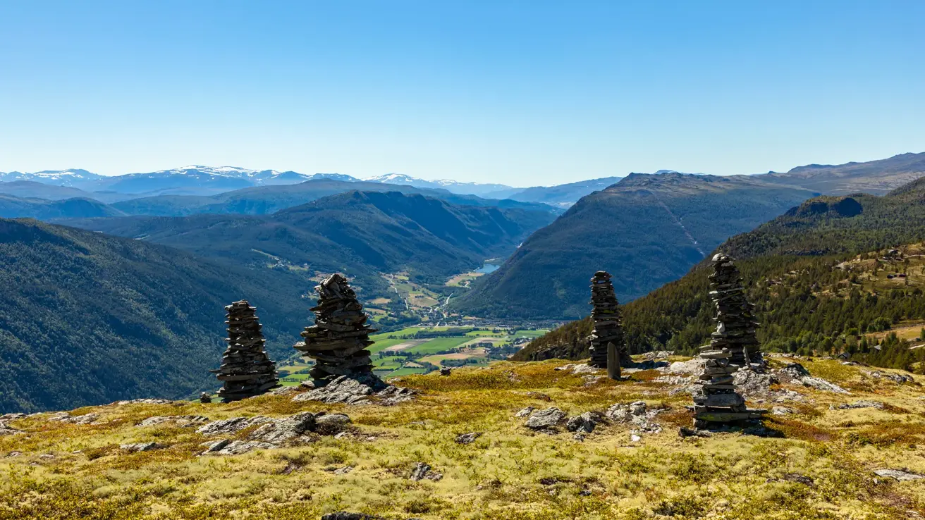 Landscape with cairns in Rondane National Park, with view to Gudbrandsdalen and Sel