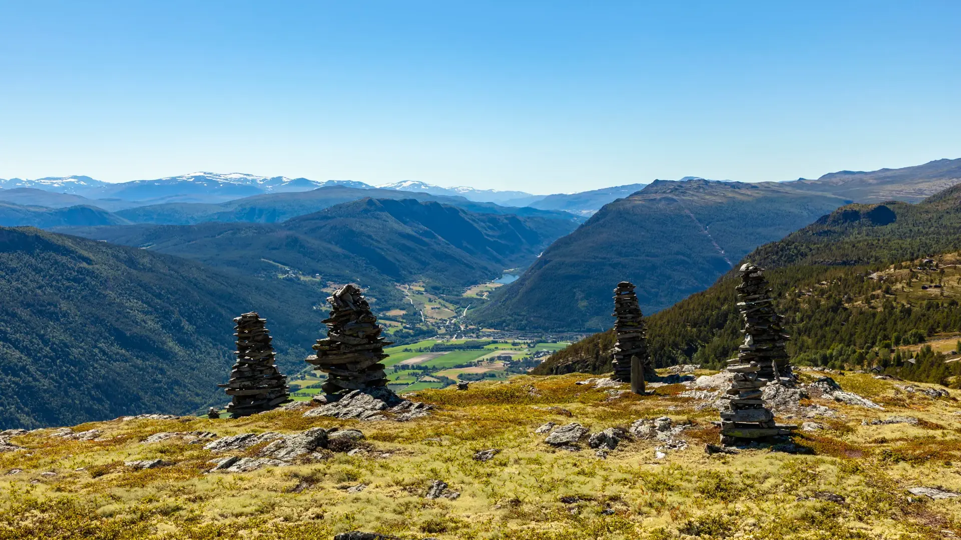 Landscape with cairns in Rondane National Park, with view to Gudbrandsdalen and Sel