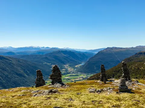 Landscape with cairns in Rondane National Park, with view to Gudbrandsdalen and Sel
