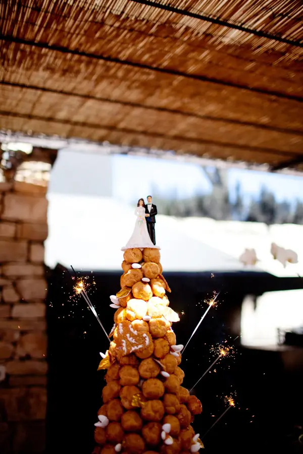 croquembouche profiterole wedding cake tower with sparklers and bride and groom cake topper