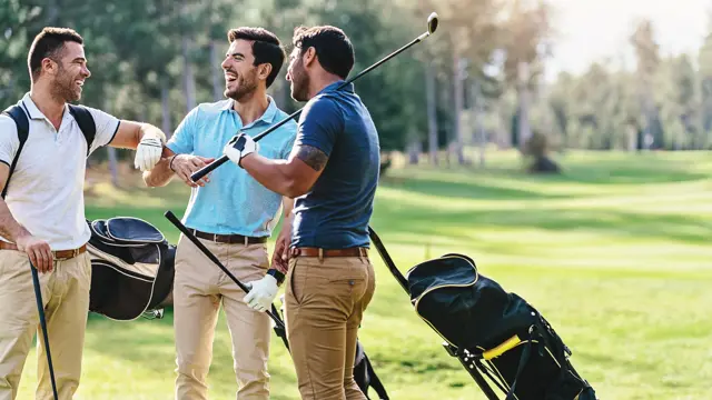 Multi-ethnic group of male golf players talking on the course playground