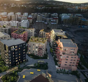 Fugleperspektiv på boligblokker i solnedgang. 3D-illustrasjon.
