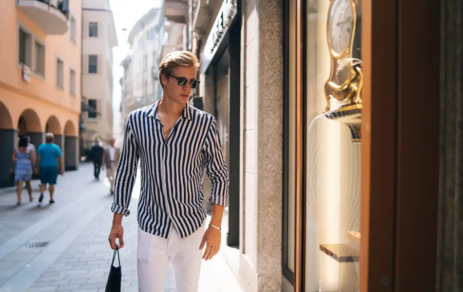 He looks into a store window