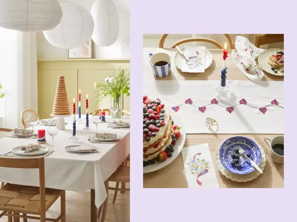 Bord dekket til 17. mai med hvit duk, kransekake, blomster, hvitt servise og stearinlys. Bord med kake, løper, stearinlys og servise.