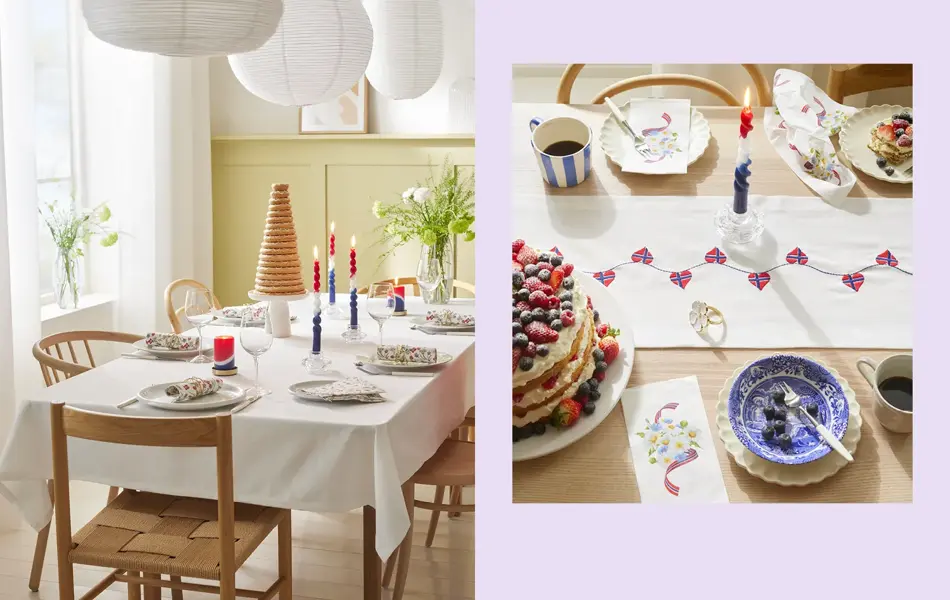 Bord dekket til 17. mai med hvit duk, kransekake, blomster, hvitt servise og stearinlys. Bord med kake, løper, stearinlys og servise.