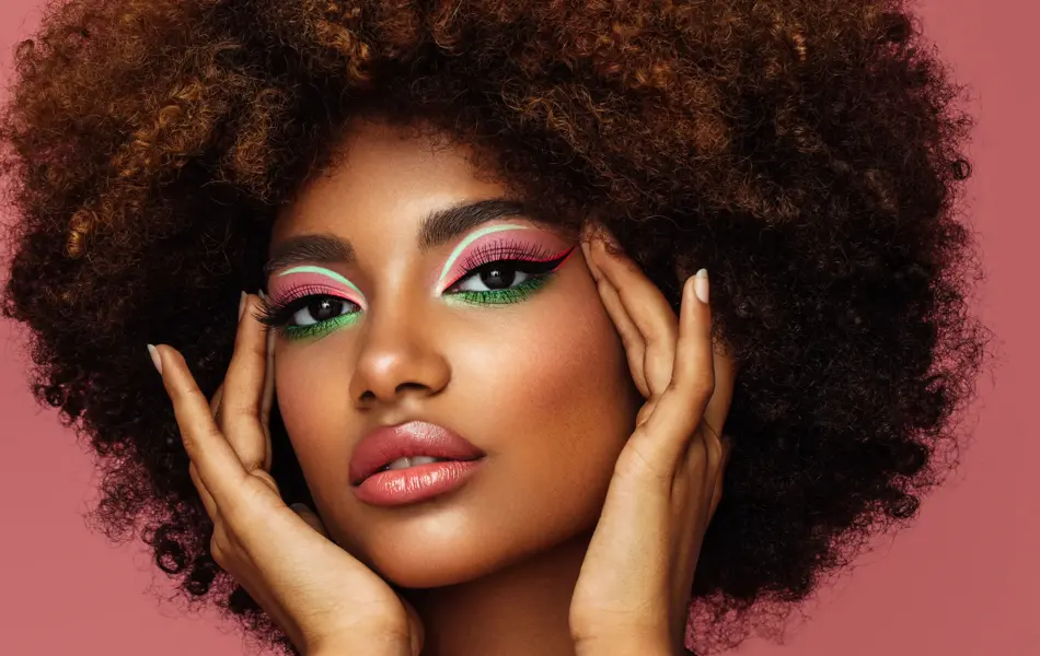 Portrait of young afro woman with bright make-up