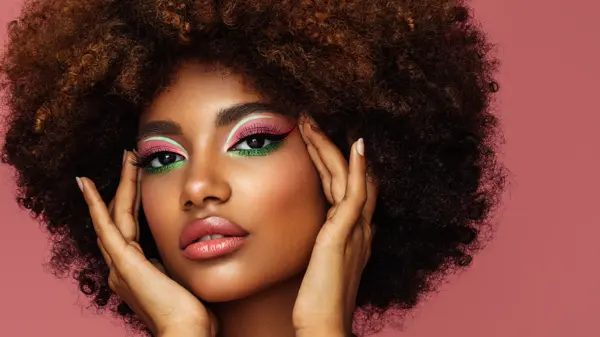 Portrait of young afro woman with bright make-up