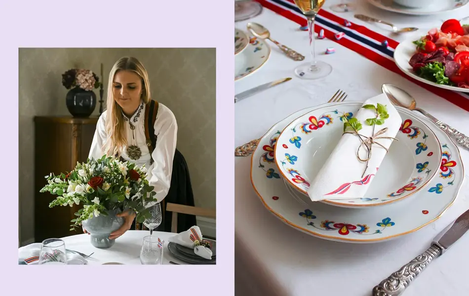 Ung dame i bundad setter en vase med blomster på bordet. Nærbilde at kuvert, bondemønstret servise og sølvbestikk.