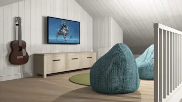 Bilde av to stoler foran en TV og en gitar som henger på veggen i en hems på Austlid