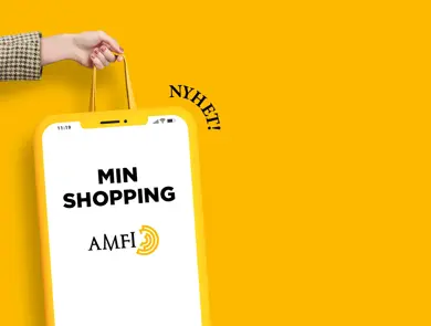 Dame som holder en pose med teksten "min shopping - amfi"