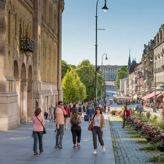Oslo, Norway – July 17, 2017: People enjoying the summer at central station  street in Oslo, Norway
