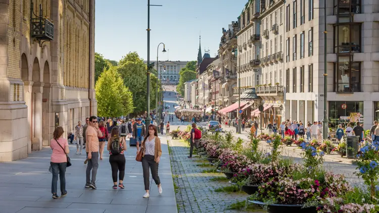 Oslo, Norway – July 17, 2017: People enjoying the summer at central station  street in Oslo, Norway