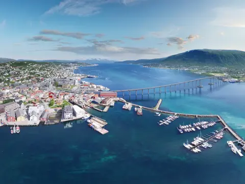 This is an aerial panoramic view over Tromso Bridge crossing Norwegian Sea. It connects Tromsdalen on the mainland and the island of Tromsøya.
