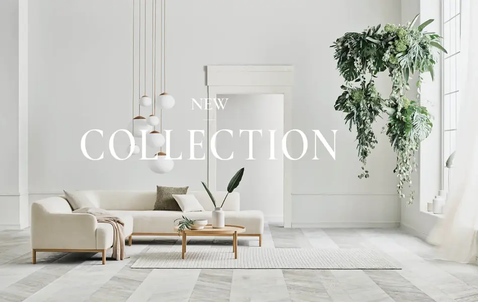 En hvit sofa fra Bolia i hvitt rom 