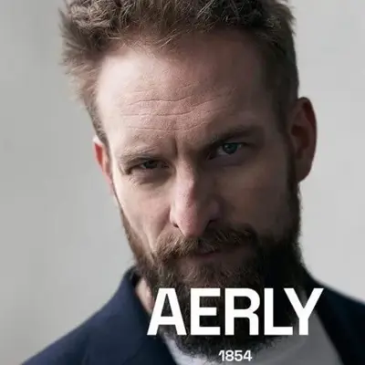 Mann med skjegg ser i kamera, teksten Aerly 1854 står nederst i bildet