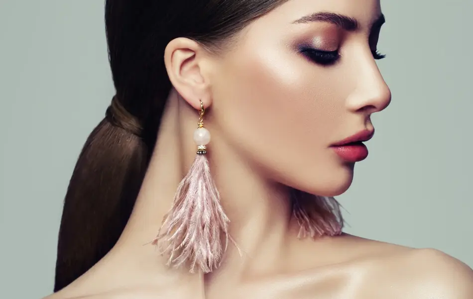 Stylish Woman with Ponytail Hairstyle and Pink Earrings