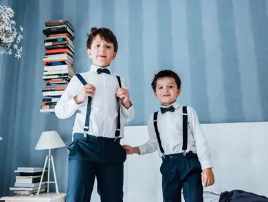 Cute little boys playing indoors. They are preparing for their uncle and aunt wedding.