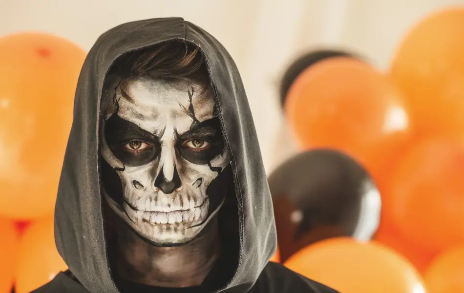 Copy space shot of young man disguised as grim reaper. 