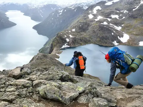 Jotunheimen: People hike the Besseggen trail in Jotunheimen National Park, Norway. Norway had almost 5 million foreign visitors in 2011.