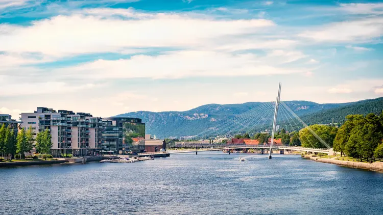Drammenselva river. "Ypsilon" Cable-stayed bridge. Modern apartment area.