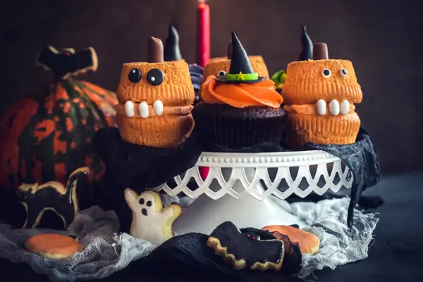 Scary Halloween cup cakes served on the table,selective focus