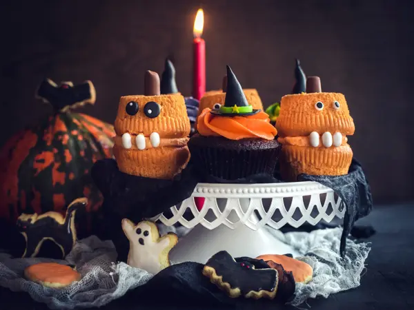 Scary Halloween cup cakes served on the table,selective focus
