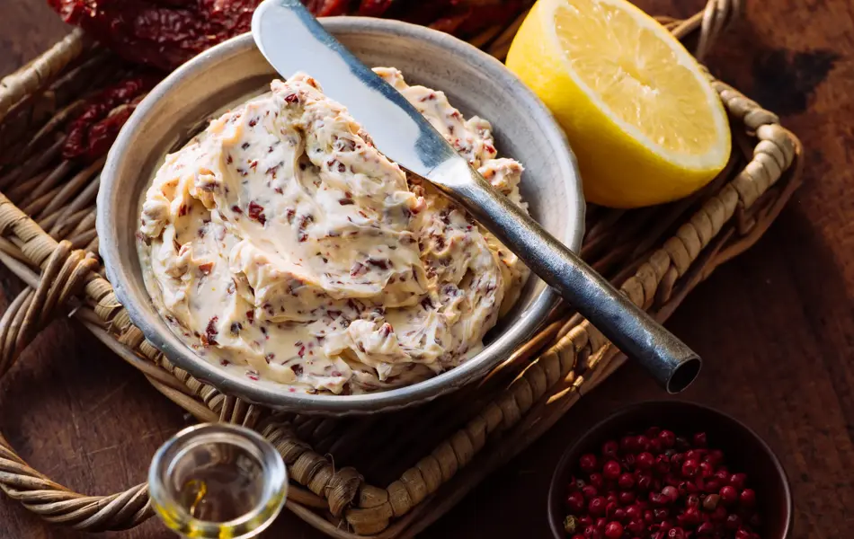 Herb butter with dried tomatoes and olives